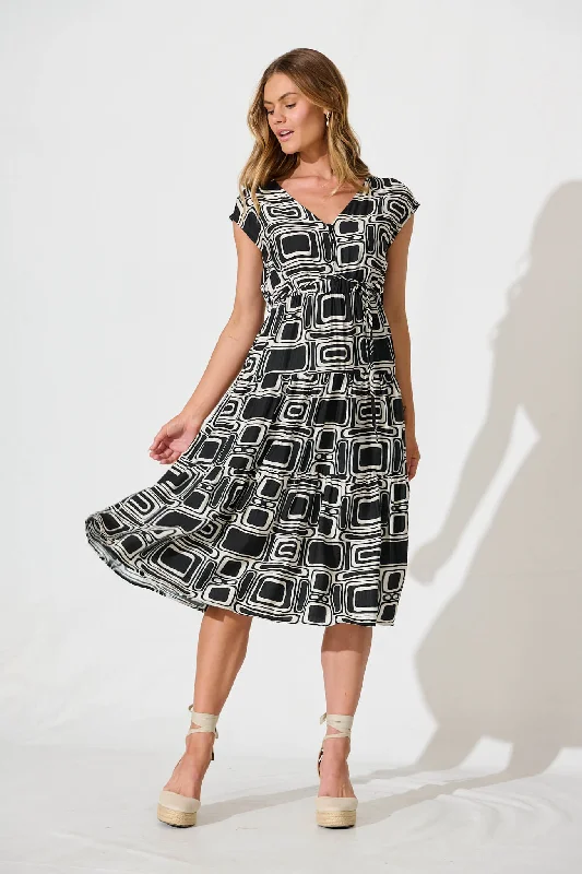 Midi dresses with puff sleeves for a vintage - inspired lookDixie Midi Dress In Black And Cream Geometric Midi dresses with puff sleeves for a vintage - inspired lookDixie Midi Dress In Black And Cream Geometric
