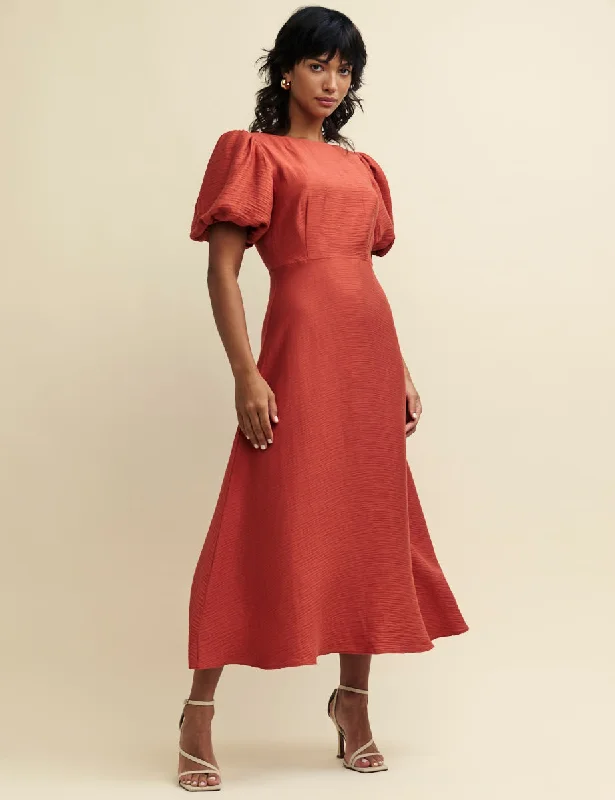 Midi dresses with animal prints for a bold and confident appearanceTerracotta Puff Sleeve Zora Midaxi Dress Midi dresses with animal prints for a bold and confident appearanceTerracotta Puff Sleeve Zora Midaxi Dress
